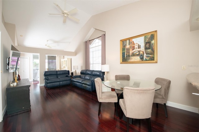 dining room featuring vaulted ceiling, hardwood / wood-style floors, and a wealth of natural light