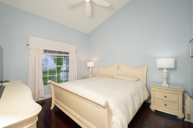 bedroom featuring lofted ceiling, dark hardwood / wood-style floors, and ceiling fan