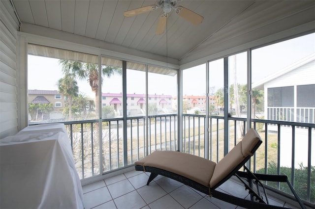 sunroom featuring vaulted ceiling and wood ceiling