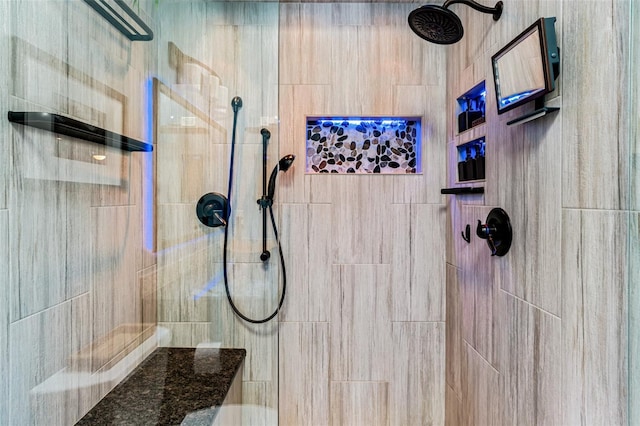 bathroom with tiled shower