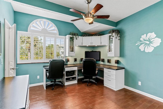 office featuring dark wood-type flooring, ceiling fan, and lofted ceiling