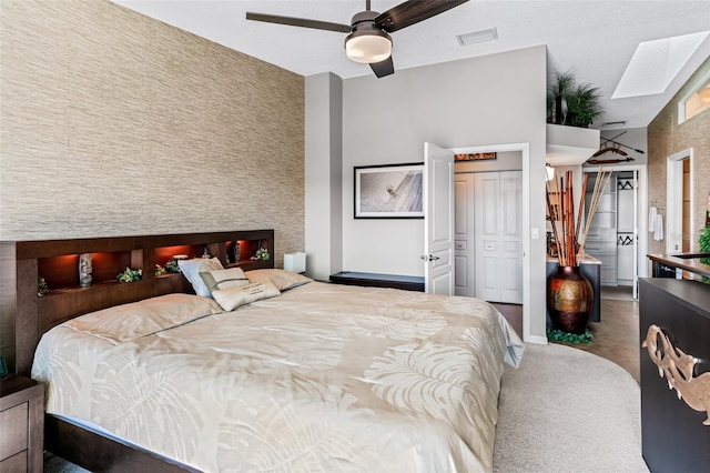 bedroom with carpet floors, a closet, and ceiling fan