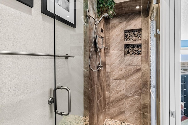 bathroom featuring an enclosed shower