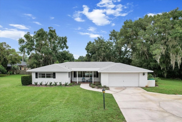 ranch-style home with a garage, a porch, and a front lawn