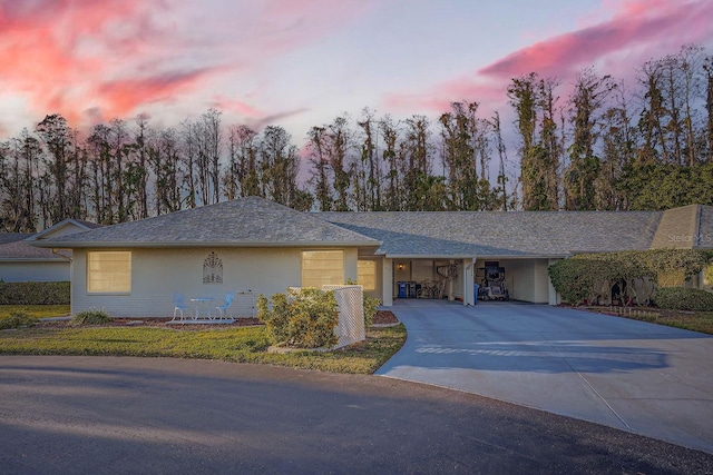 ranch-style home featuring a carport