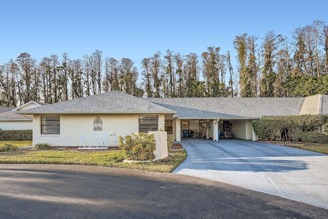 ranch-style house featuring a carport