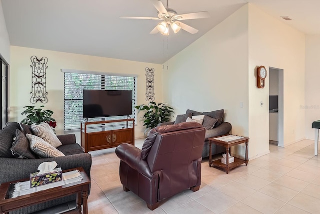 living room with light tile patterned flooring, ceiling fan, and high vaulted ceiling