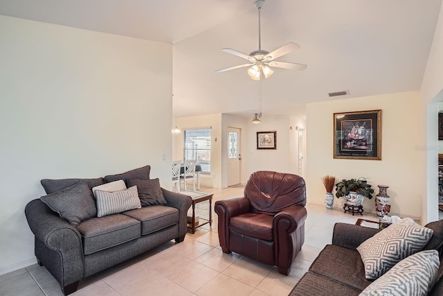 tiled living room featuring ceiling fan and high vaulted ceiling