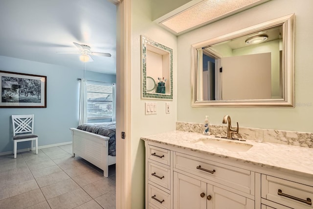 bathroom with ceiling fan, vanity, and tile patterned flooring