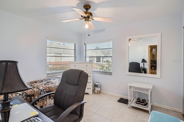 tiled office space featuring ceiling fan