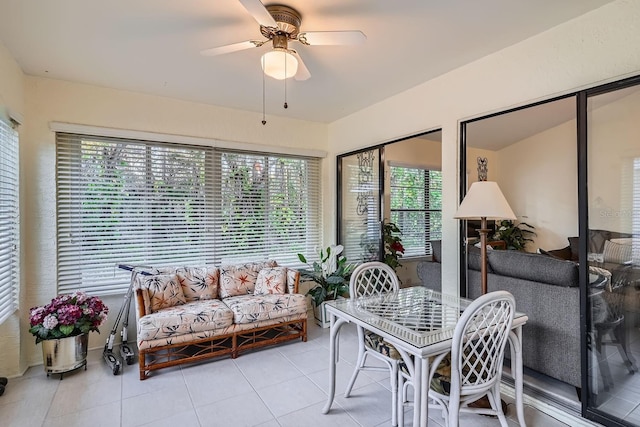 sunroom featuring ceiling fan