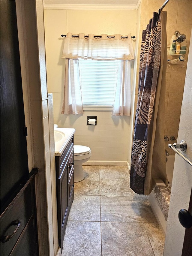 bathroom with vanity, curtained shower, ornamental molding, and toilet