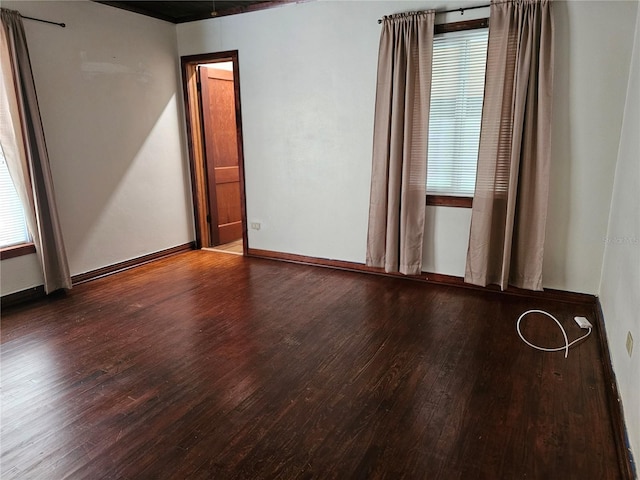 unfurnished room with hardwood / wood-style flooring