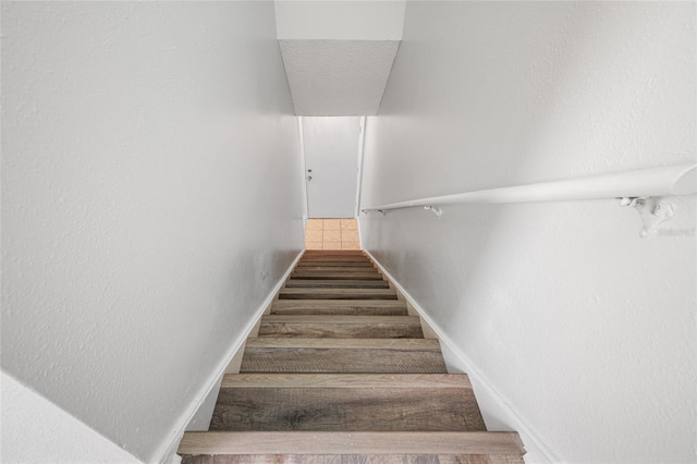 staircase with baseboards