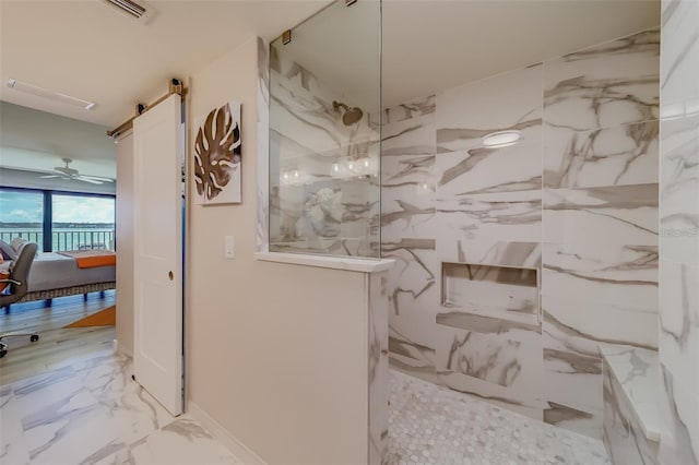 bathroom with walk in shower and ceiling fan