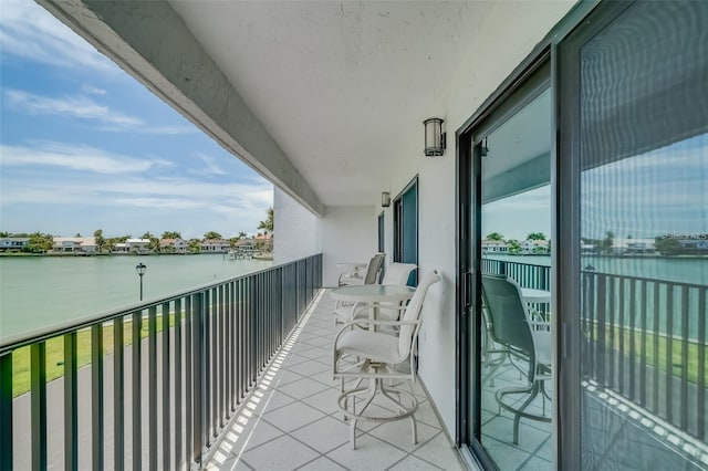 balcony featuring a water view