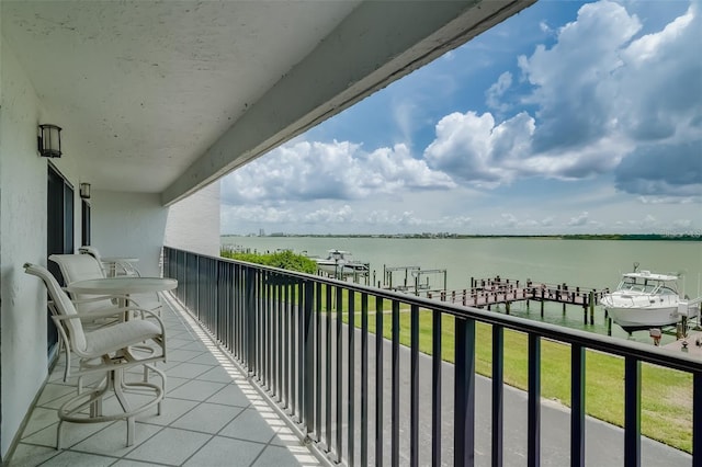 balcony featuring a water view