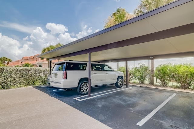 view of parking / parking lot with a carport