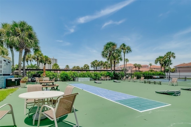 view of property's community with tennis court