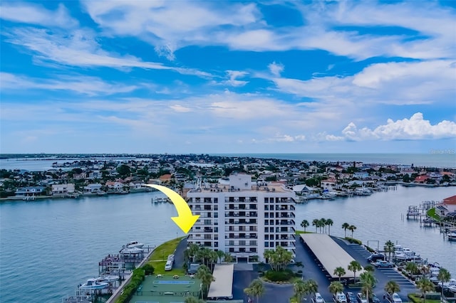 birds eye view of property with a water view