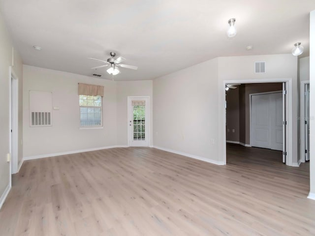 unfurnished living room with ceiling fan and light hardwood / wood-style flooring