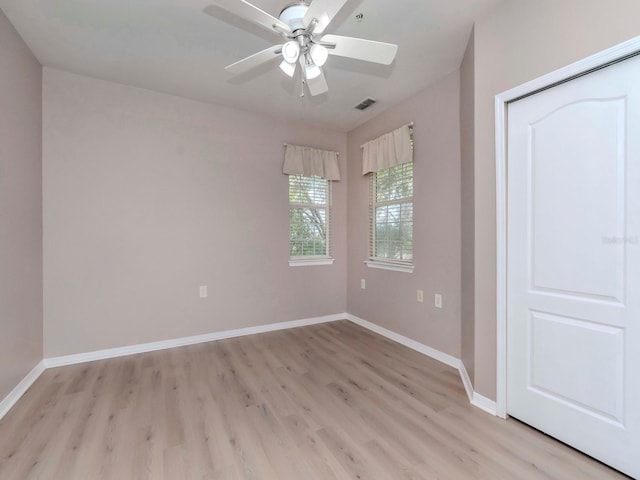 unfurnished bedroom featuring ceiling fan and light wood-type flooring