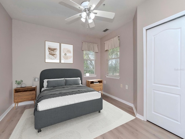 bedroom featuring light hardwood / wood-style floors and ceiling fan