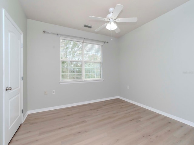 spare room with light hardwood / wood-style flooring and ceiling fan