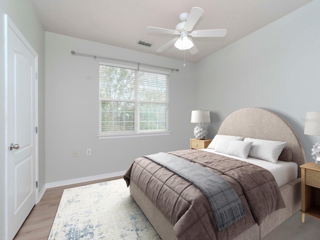 bedroom featuring light hardwood / wood-style floors and ceiling fan