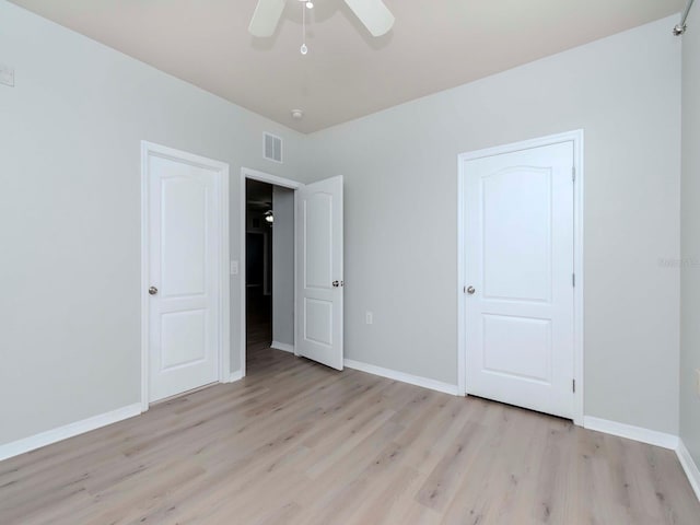 unfurnished bedroom with ceiling fan and light hardwood / wood-style flooring