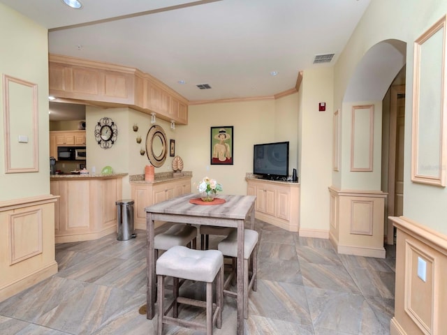 dining room featuring ornamental molding