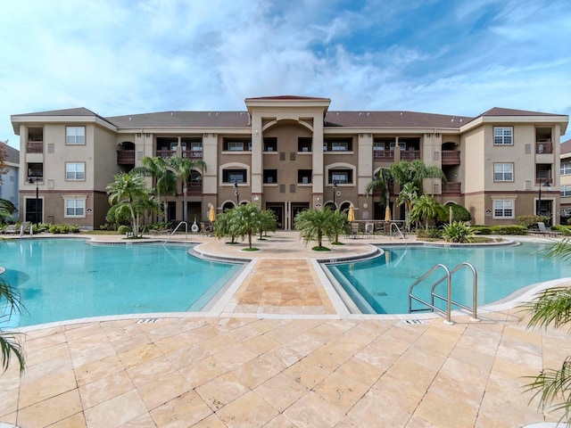 view of swimming pool featuring a patio