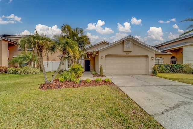 view of front of home with a garage and a front lawn