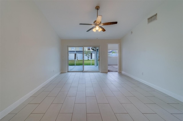 empty room with ceiling fan and lofted ceiling