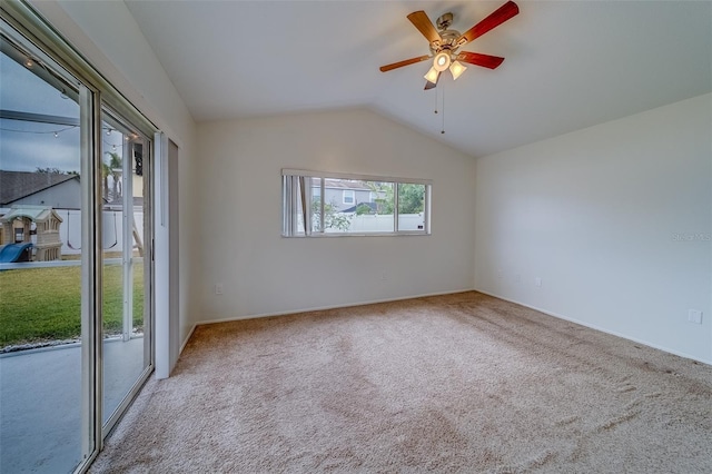 carpeted empty room with lofted ceiling and ceiling fan