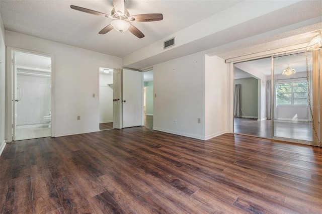 empty room featuring ceiling fan and dark hardwood / wood-style flooring