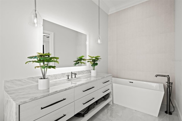 bathroom with ornamental molding, a bathing tub, and vanity