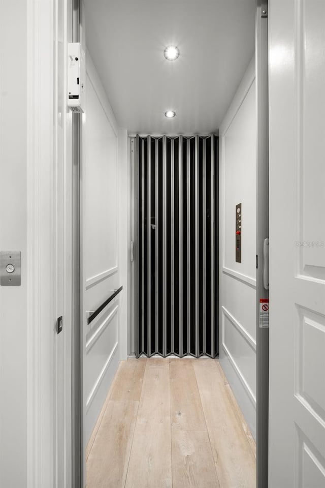 hallway featuring light hardwood / wood-style floors