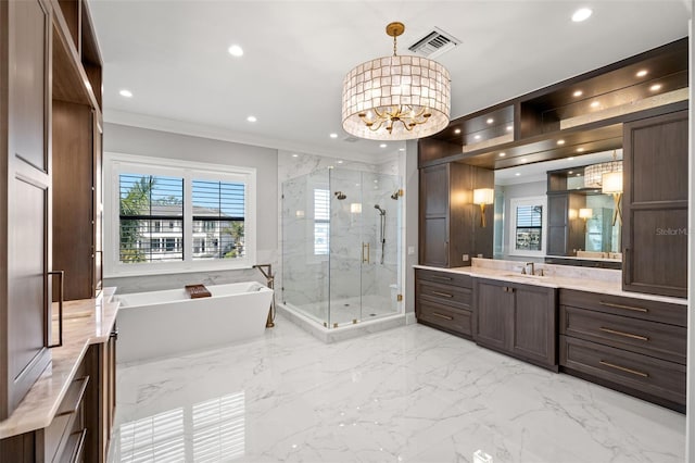 bathroom with plus walk in shower, crown molding, vanity, and an inviting chandelier