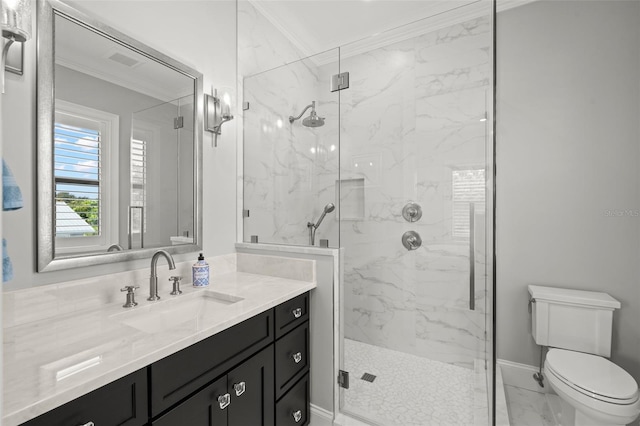 bathroom featuring vanity, crown molding, a shower with shower door, and toilet