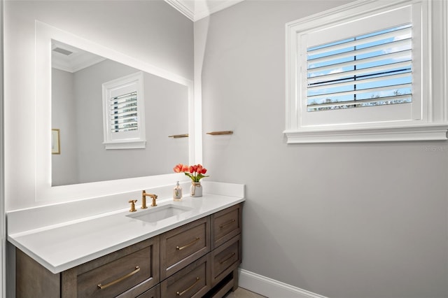 bathroom with vanity and crown molding