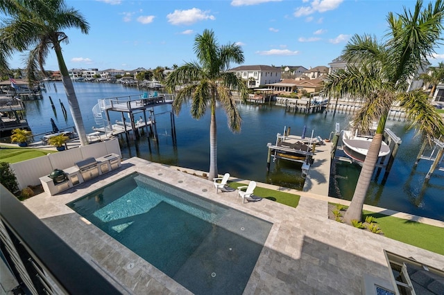 view of dock with a fenced in pool, a water view, and a patio area