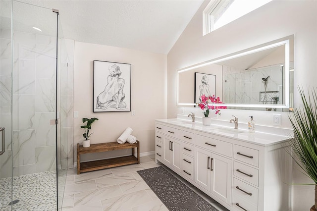 bathroom featuring vanity, vaulted ceiling, a shower with door, and a textured ceiling