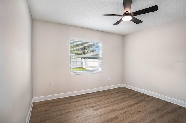 unfurnished room featuring ceiling fan, wood-type flooring, and a textured ceiling