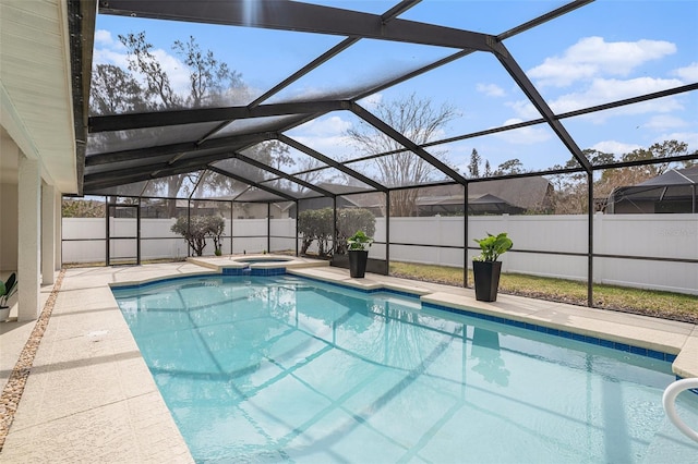 view of pool featuring an in ground hot tub, a lanai, and a patio