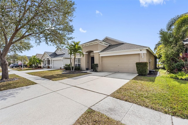 view of front of property with a garage and a front lawn