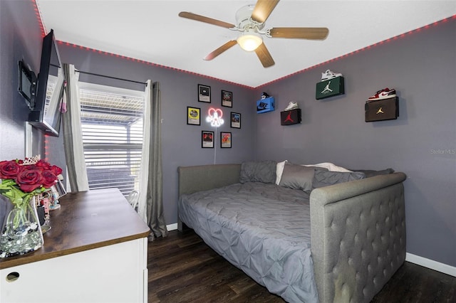 bedroom with dark wood-type flooring and ceiling fan