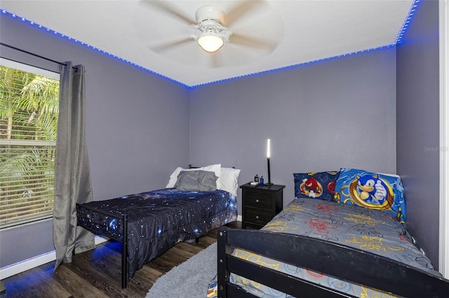 bedroom featuring ceiling fan and dark hardwood / wood-style flooring