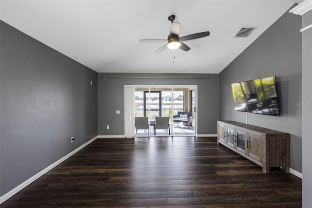 unfurnished living room featuring ceiling fan, lofted ceiling, and dark hardwood / wood-style floors