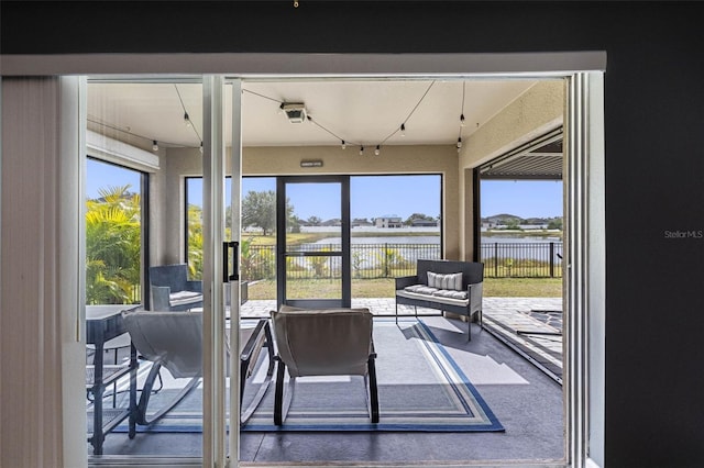 sunroom with a water view